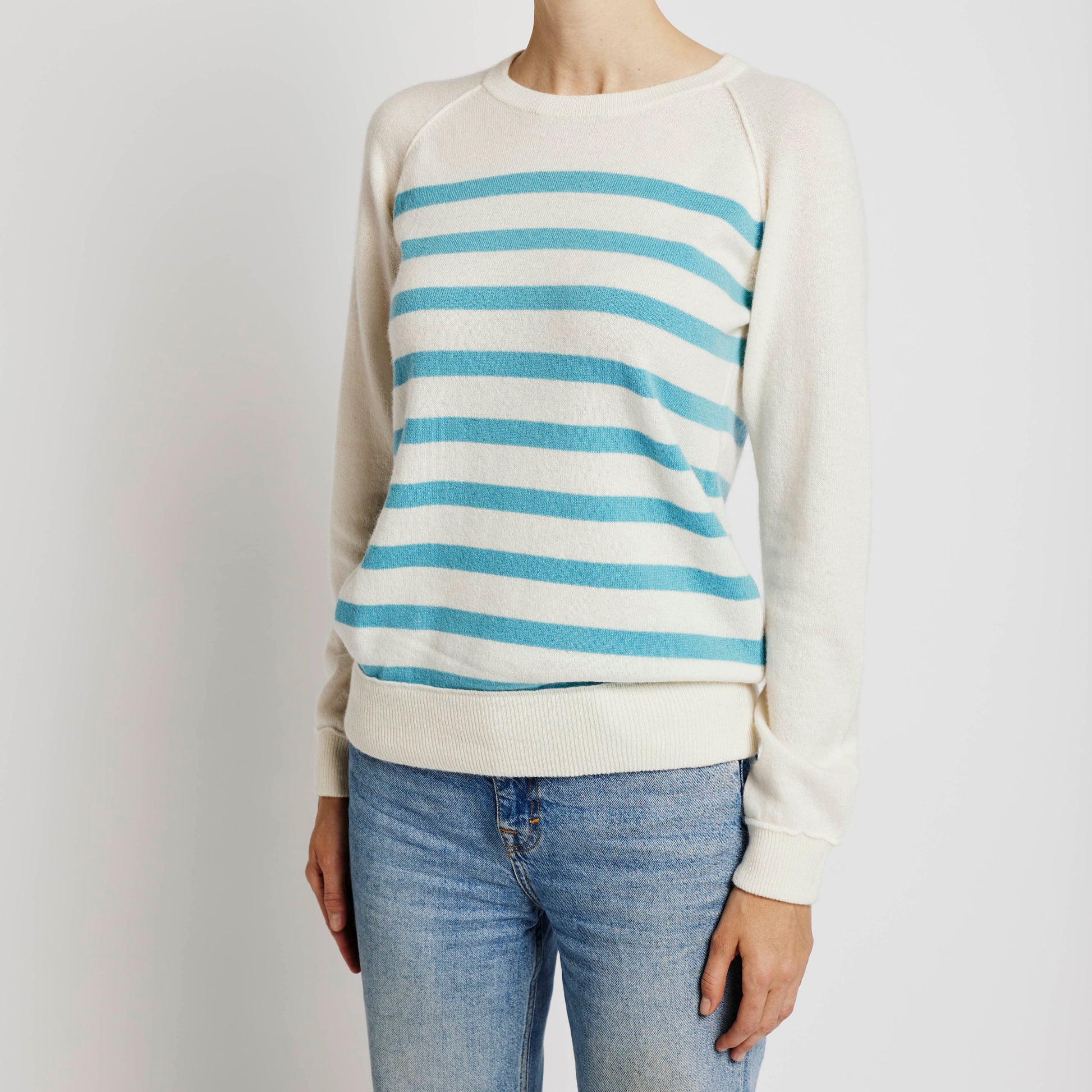 Alabaste Le Breton cashmere sweater in Chinese blue and cream, front view on model wearing size small, featuring horizontal stripes and raglan sleeves, made from 100% Mongolian cashmere.
