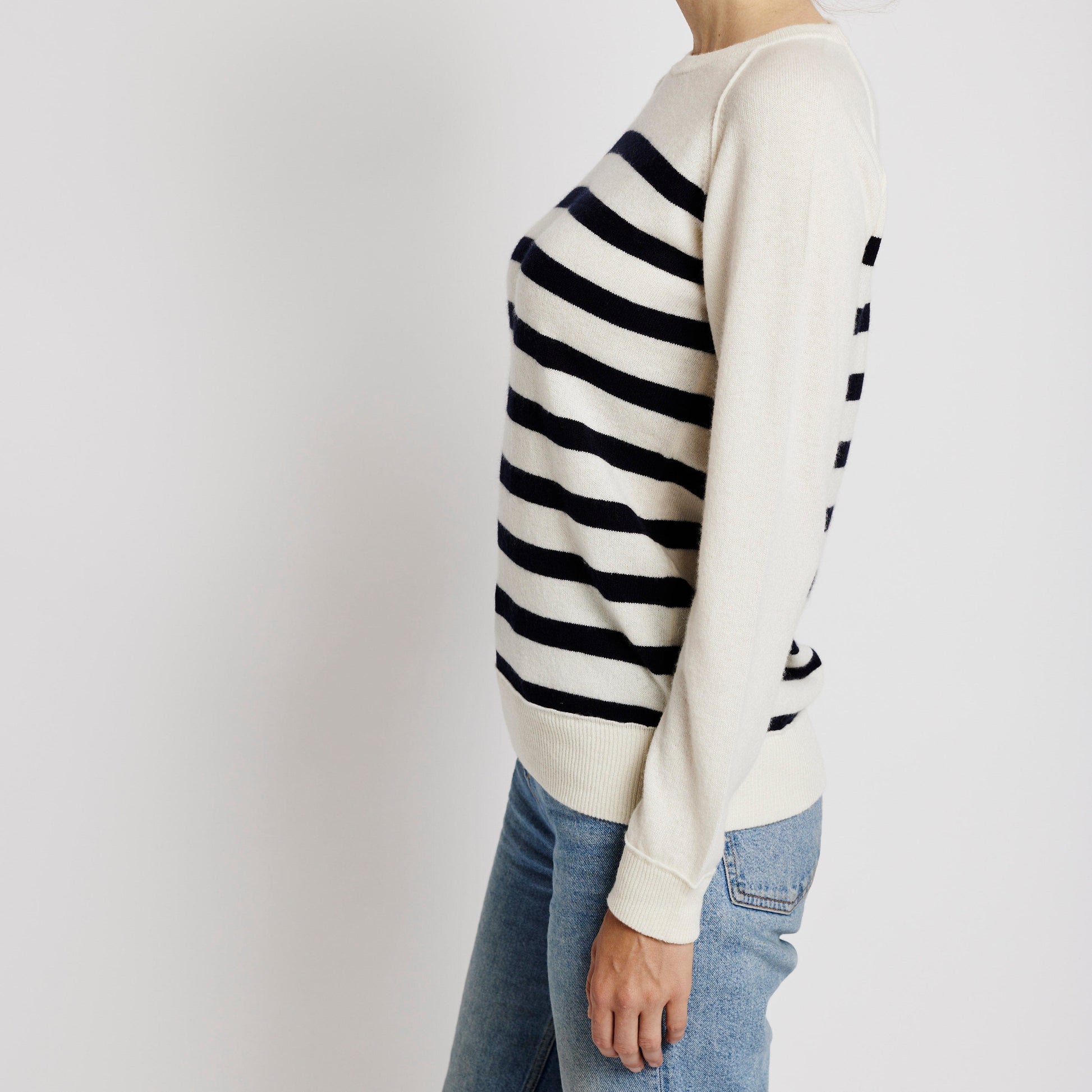 Alabaste Le Breton cashmere striped sweater in black and cream, side view, 100% Mongolian cashmere, fully-fashioned with raglan sleeves.